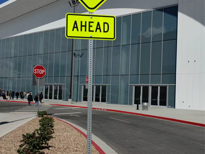 Ahead signs on square sign post